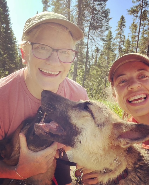 Poppy Potter and Molly outdoors with their dogs